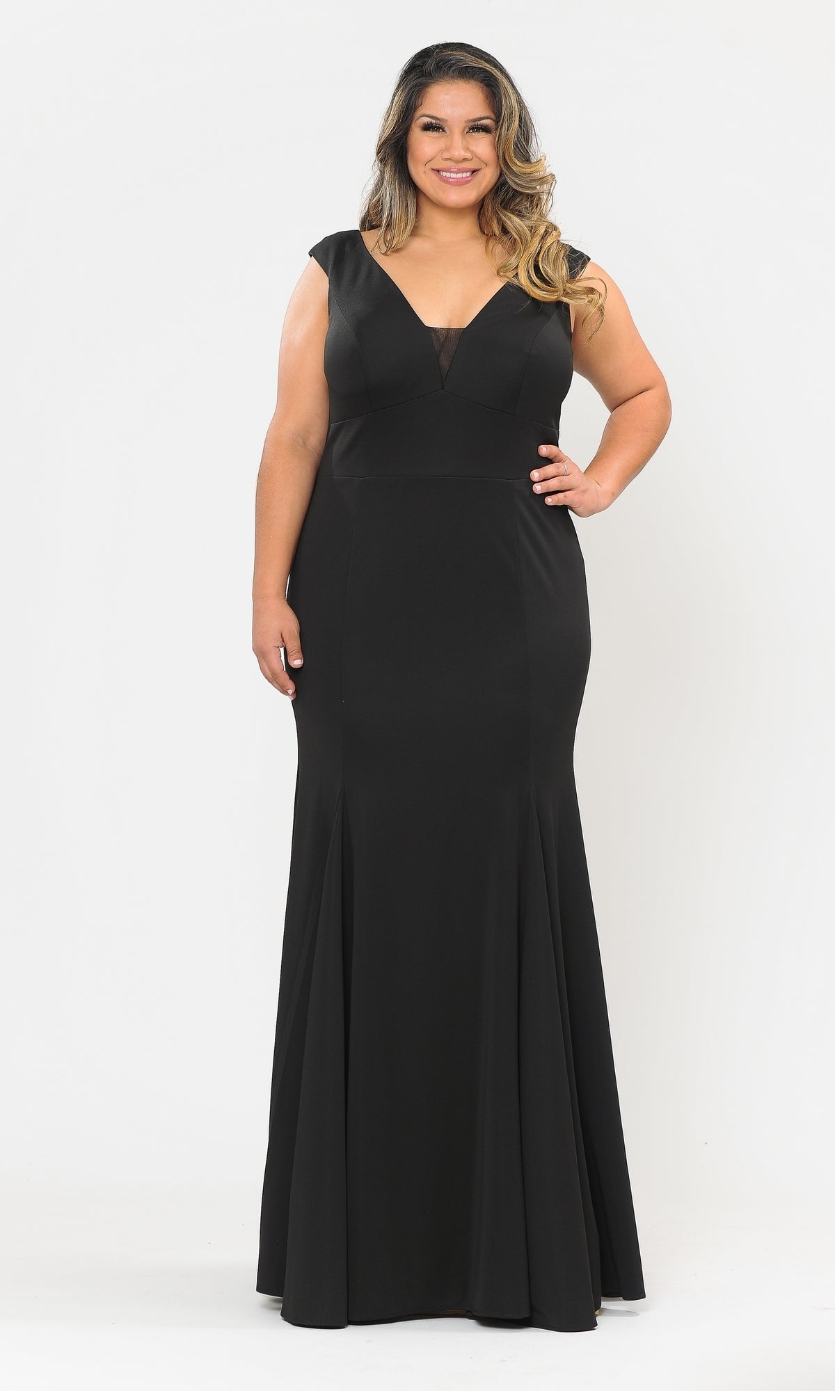 A woman smiles facing forward in the Classic Sleeveless Plus-Size Long Prom Dress W1022—a floor-length, black gown with a V-neckline—posing against a plain white background.